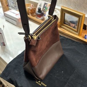 Rag and bone new bag in a dark maroon color it’s a suede/leather bag